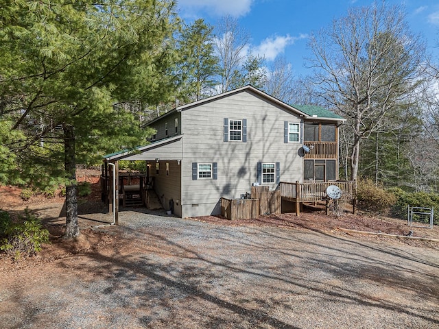 rear view of property with a sunroom