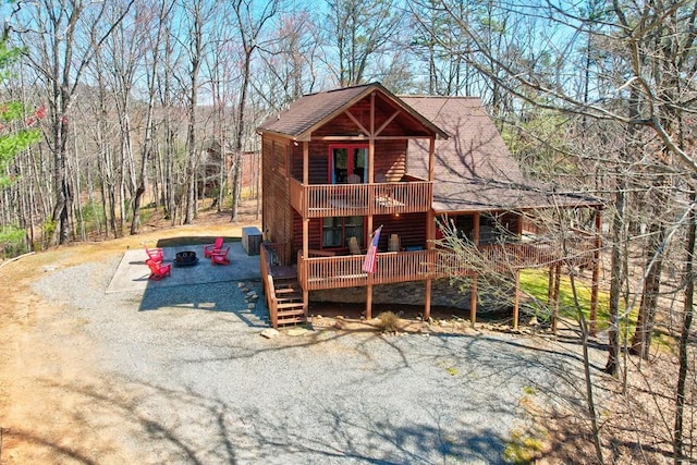480 Sugar Mountain Rd, Blue Ridge, GA 30513 - view of front facade with log veneer siding, roof with shingles, and a wooden deck