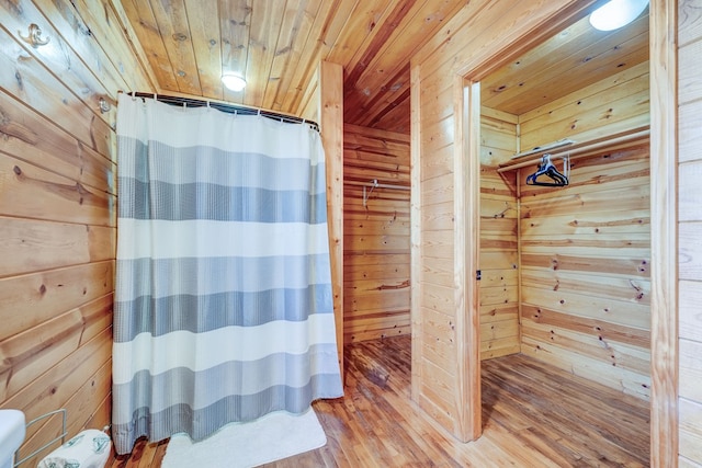 480 Sugar Mountain Rd, Blue Ridge, GA 30513 - full bath featuring wood ceiling, curtained shower, wood finished floors, and wooden walls