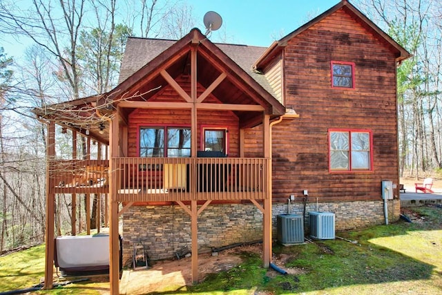480 Sugar Mountain Rd, Blue Ridge, GA 30513 - back of property with central air condition unit, a shingled roof, and a yard