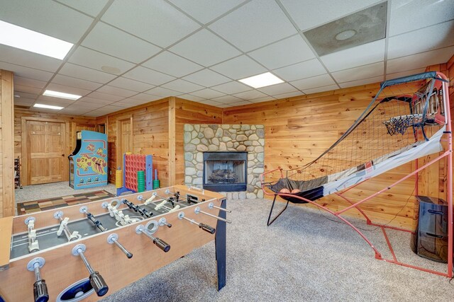480 Sugar Mountain Rd, Blue Ridge, GA 30513 - recreation room featuring a stone fireplace, wood walls, carpet flooring, and a drop ceiling