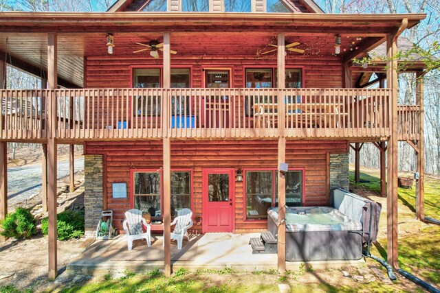 480 Sugar Mountain Rd, Blue Ridge, GA 30513 - rear view of house with stone siding, a patio, and a ceiling fan