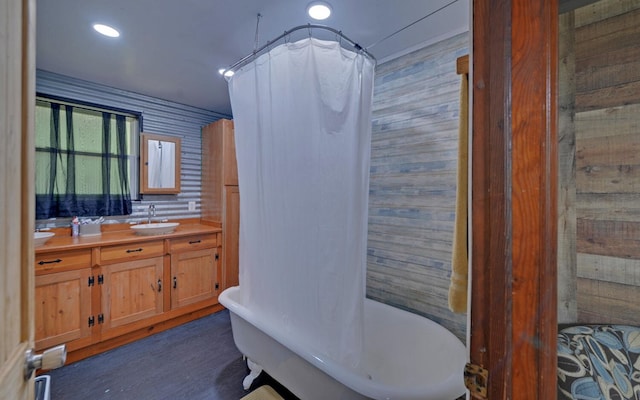 209 Vengeance Creek Rd, Marble, NC 28905 - bathroom featuring a freestanding bath, double vanity, curtained shower, wood finished floors, and wood walls