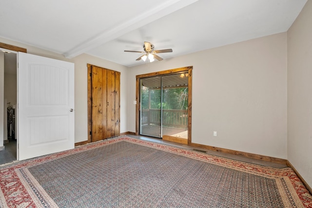 empty room with beamed ceiling and ceiling fan