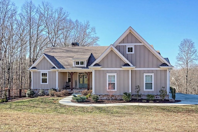 view of front of property with a porch and a front lawn