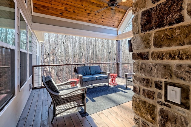 exterior space with ceiling fan, lofted ceiling, and wooden ceiling