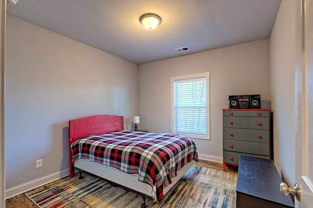 bedroom with hardwood / wood-style flooring