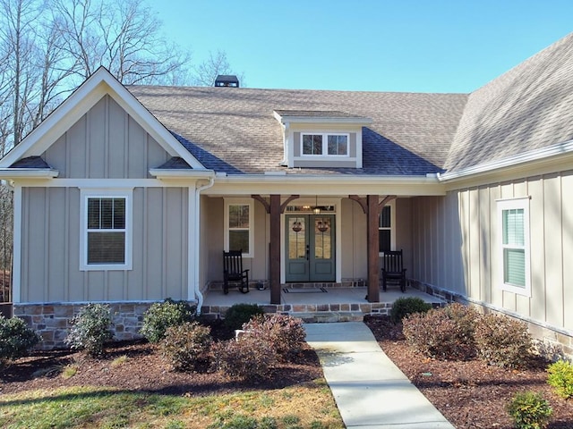 entrance to property featuring french doors and covered porch