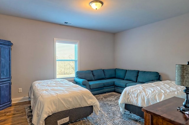 bedroom featuring dark hardwood / wood-style flooring