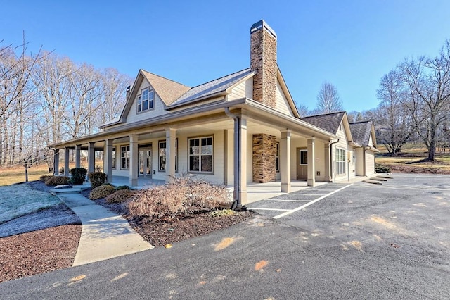 view of home's exterior featuring a porch