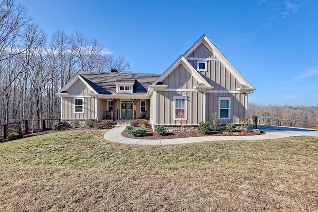 view of front facade featuring a front lawn and covered porch