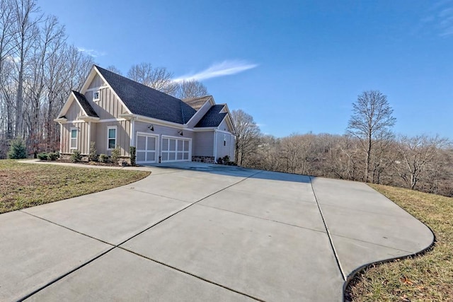 exterior space with a yard and a garage