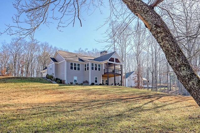 view of side of home featuring a yard