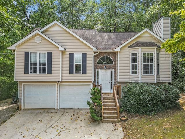 split foyer home featuring a garage