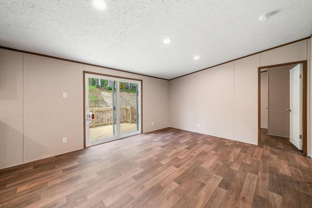 220 Jetty Dr, Ellijay, GA 30540 - unfurnished room with ornamental molding, wood finished floors, a smoke detector, a textured ceiling, and recessed lighting