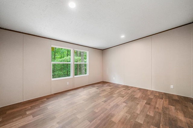 220 Jetty Dr, Ellijay, GA 30540 - unfurnished room with wood finished floors, recessed lighting, a decorative wall, and crown molding
