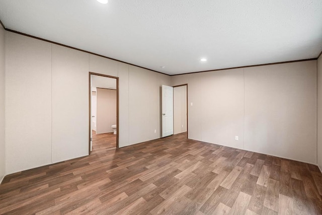 220 Jetty Dr, Ellijay, GA 30540 - spare room featuring wood finished floors, recessed lighting, and ornamental molding