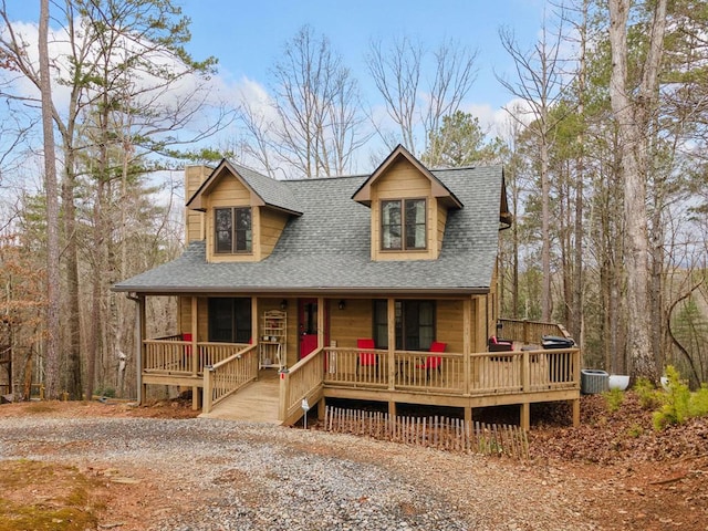 2267 Newport Dr, Ellijay, GA 30540 - view of front of property featuring roof with shingles, a chimney, covered porch, and central AC