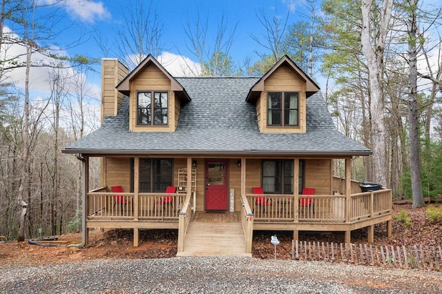 2267 Newport Dr, Ellijay, GA 30540 - view of front of property featuring covered porch, roof with shingles, and a chimney