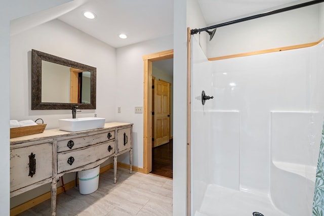 2267 Newport Dr, Ellijay, GA 30540 - full bathroom with a walk in shower, vanity, baseboards, and recessed lighting
