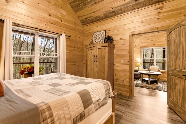 184 Rockhouse Rd, Cherry Log, GA 30522 - bedroom featuring lofted ceiling, wooden walls, and wood finished floors