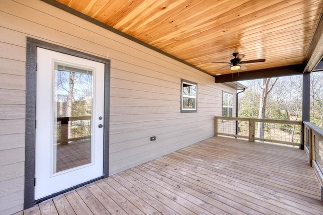 wooden terrace featuring ceiling fan