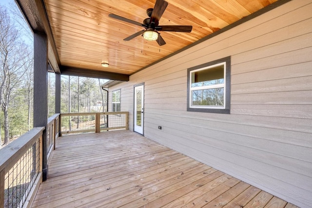 wooden terrace with a ceiling fan