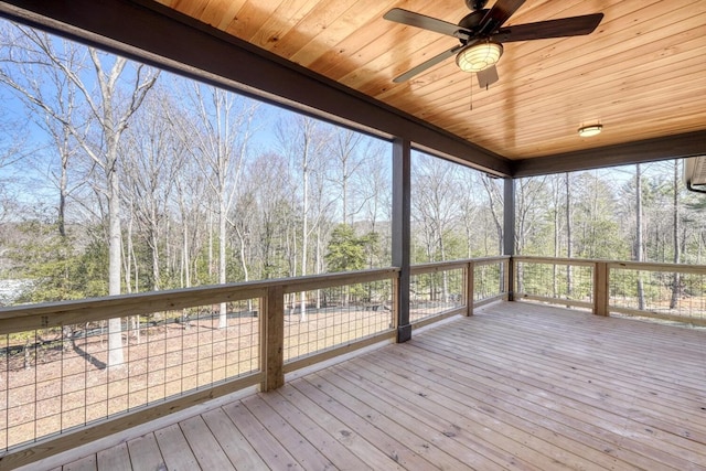 wooden terrace featuring a ceiling fan