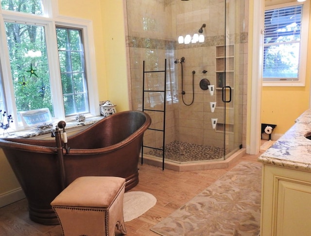 120 Sunrock Mountain Trc, Blue Ridge, GA 30513 - bathroom with a shower stall, a soaking tub, vanity, and wood finished floors