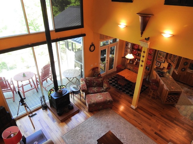 120 Sunrock Mountain Trc, Blue Ridge, GA 30513 - living room featuring hardwood / wood-style flooring, a high ceiling, and a wood stove