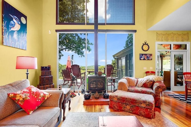 120 Sunrock Mountain Trc, Blue Ridge, GA 30513 - living area with wood finished floors, a wood stove, and a towering ceiling