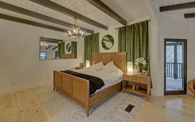 bedroom featuring beam ceiling, light hardwood / wood-style flooring, and a notable chandelier