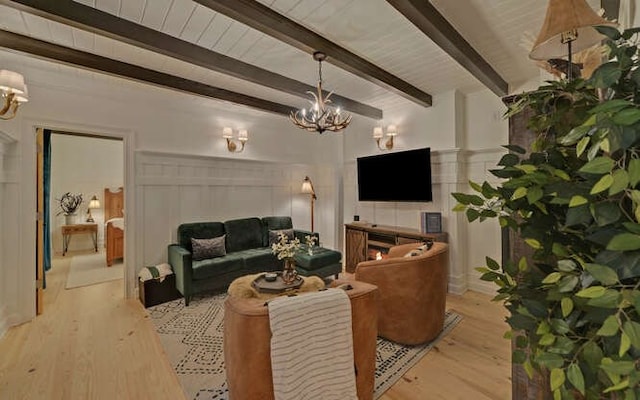 7670 Hiawassee Wilderness, Hiawassee, GA 30546 - living room with a chandelier, light wood-type flooring, and beamed ceiling