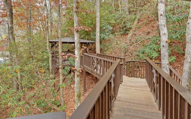 7670 Hiawassee Wilderness, Hiawassee, GA 30546 - wooden deck with a gazebo and a forest view