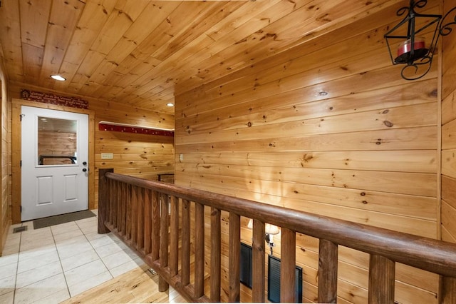 608 Pine Pass Cir, Mineral Bluff, GA 30559 - hallway with an upstairs landing, wood ceiling, wood walls, light tile patterned flooring, and recessed lighting