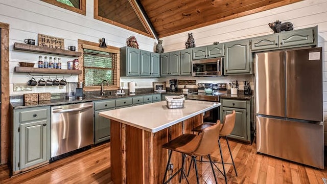 437 Spruce Cir, Mineral Bluff, GA 30559 - kitchen with appliances with stainless steel finishes, wood ceiling, vaulted ceiling, a sink, and light wood finished floors