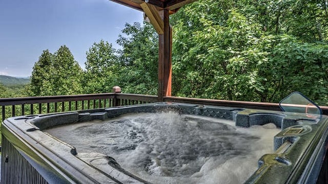 437 Spruce Cir, Mineral Bluff, GA 30559 - deck featuring a hot tub