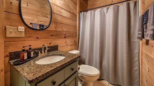 437 Spruce Cir, Mineral Bluff, GA 30559 - bathroom featuring wooden walls, vanity, toilet, and a shower with curtain