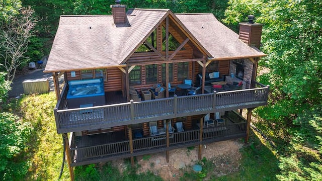437 Spruce Cir, Mineral Bluff, GA 30559 - back of house with a chimney, a wooden deck, and faux log siding