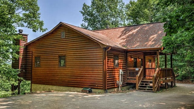 437 Spruce Cir, Mineral Bluff, GA 30559 - view of property exterior with a chimney and faux log siding