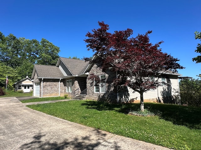 1207 Bullen Gap Rd, Blue Ridge, GA 30513 - view of front facade featuring stone siding, a garage, a front yard, and concrete driveway