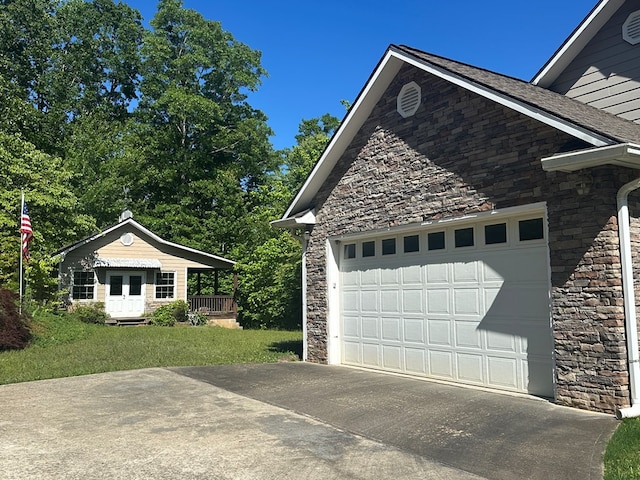 1207 Bullen Gap Rd, Blue Ridge, GA 30513 - view of side of home with stone siding, driveway, and a garage
