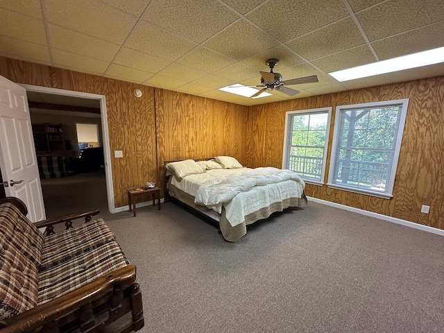 1207 Bullen Gap Rd, Blue Ridge, GA 30513 - carpeted bedroom featuring a paneled ceiling, ceiling fan, wooden walls, and baseboards
