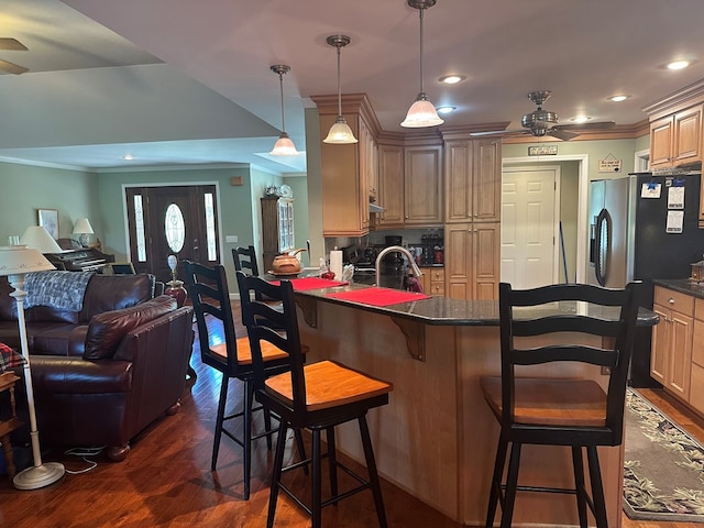 1207 Bullen Gap Rd, Blue Ridge, GA 30513 - kitchen with ceiling fan, ornamental molding, dark wood-style flooring, open floor plan, and a breakfast bar