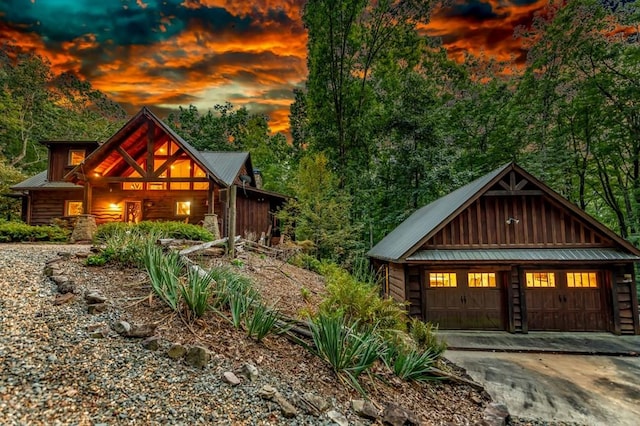 log home featuring a garage