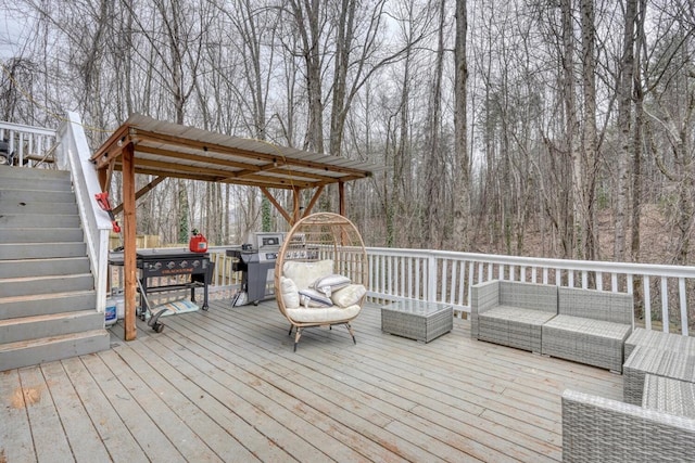 deck with stairs, an outdoor hangout area, and area for grilling