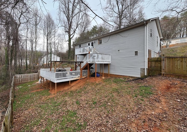 back of house featuring a fenced backyard, stairway, and a deck