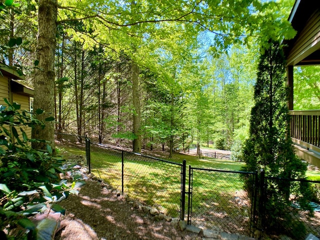view of yard with fence and a gate