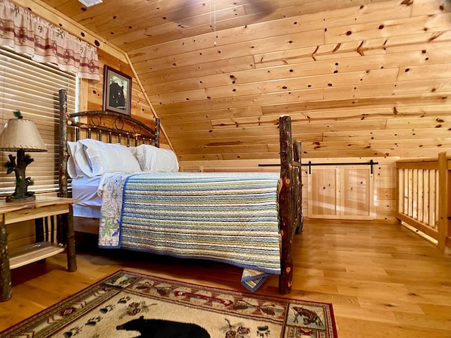bedroom featuring wood ceiling, vaulted ceiling, wood walls, and wood finished floors