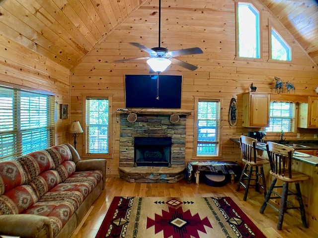 living room with wooden walls, high vaulted ceiling, wooden ceiling, and hardwood / wood-style flooring